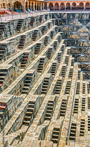 Chand Baori in Abhaneri, built in the 8th–9th century CE by King Chanda, is a deep, geometric stepwell with 3,500 steps, showcasing ancient water conservation, climate-smart design.