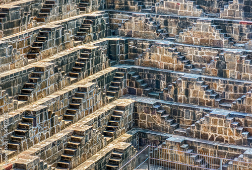 Chand Baori in Abhaneri, built in the 8th–9th century CE by King Chanda, is a deep, geometric stepwell with 3,500 steps, showcasing ancient water conservation, climate-smart design.
