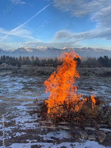 Winter bonfire in the Bitterroot Valley, Montana; Bitterroot Mountains in the background. 