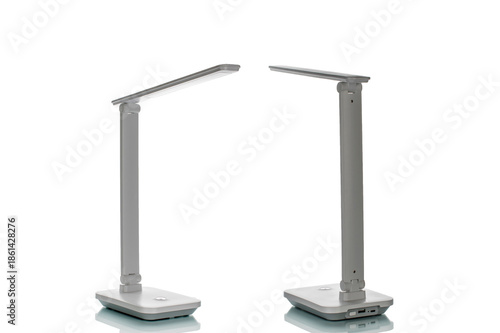 Table LED lamp with batteries isolated on white background, close-up.