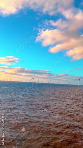 Wallpaper Mural Blue sky with windmills over ocean, Vivid turquoise sky with wind turbines and dynamic ocean landscape Torontodigital.ca
