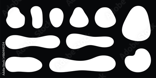 set of white abstract shapes on black background
