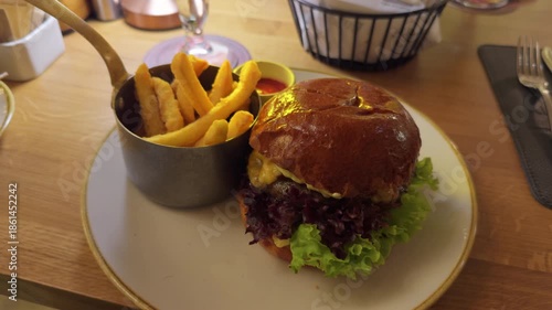 Wallpaper Mural Gourmet sandwich with crispy sides, Stylish culinary photo showcasing burger with fries and ambiance Torontodigital.ca