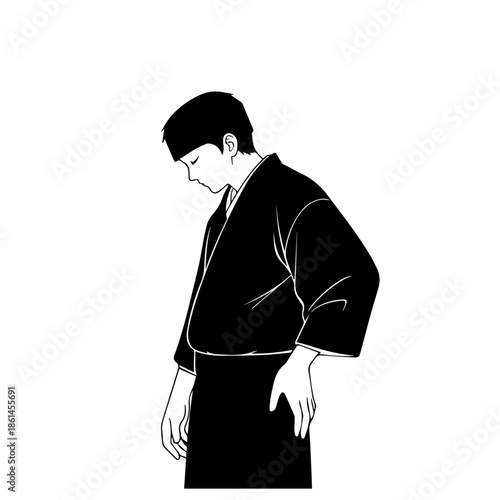 A man in a martial arts uniform bowing