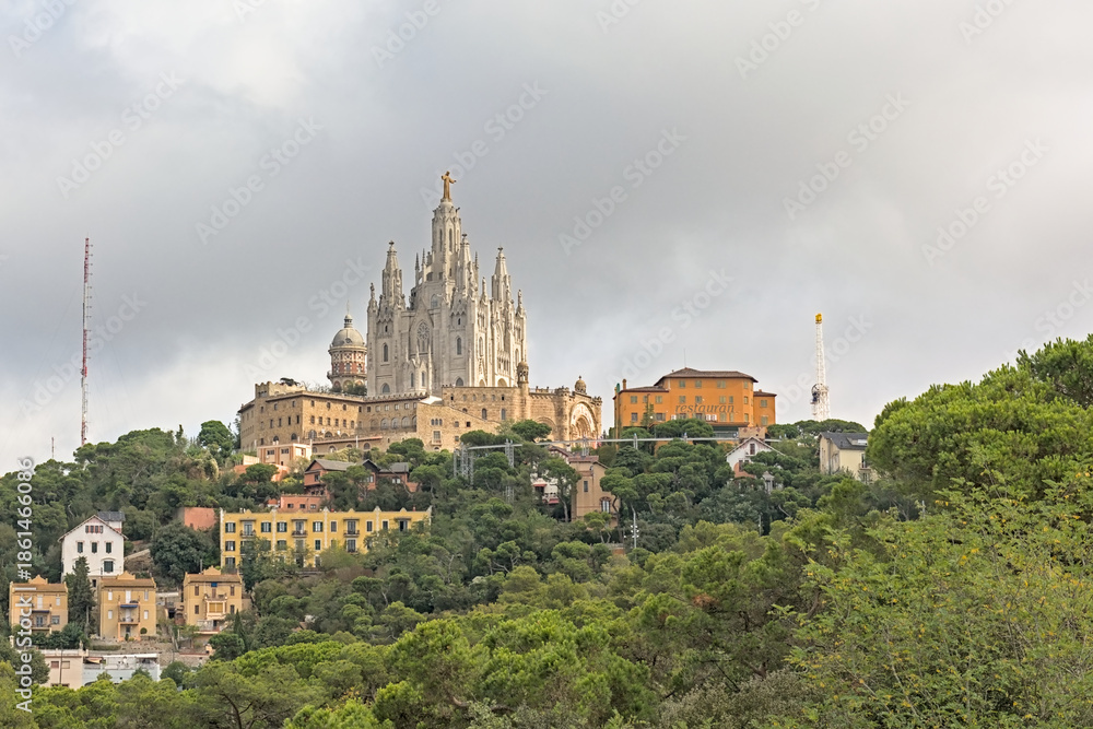 Obraz premium Sagrat Cor church on Tibidabo hill, with golden jesus statue on top, Catalonia Spain