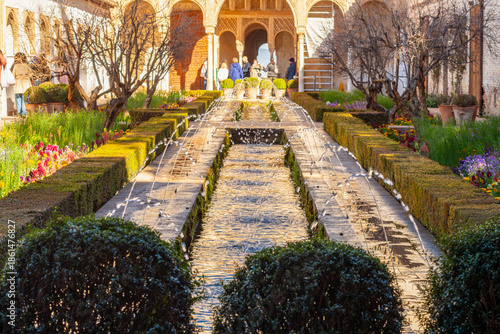 Patio de la Acequia (Water channel) in Generalife gardens at Alhambra, Granada, Spain
