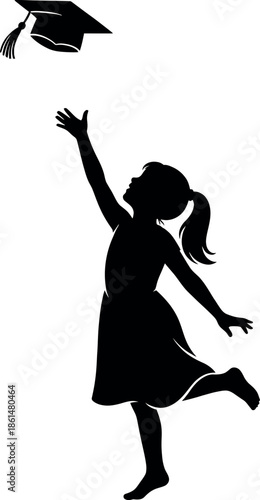 Silhouette of a happy young girl throwing her graduation cap in the air