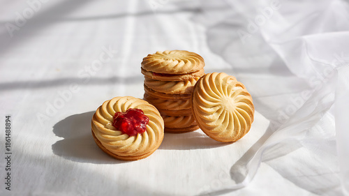 A closeup of delicious homemade chocolate chip cookies served on a white plate, creating a tasty sweet snack and baked dessert from the local bakery