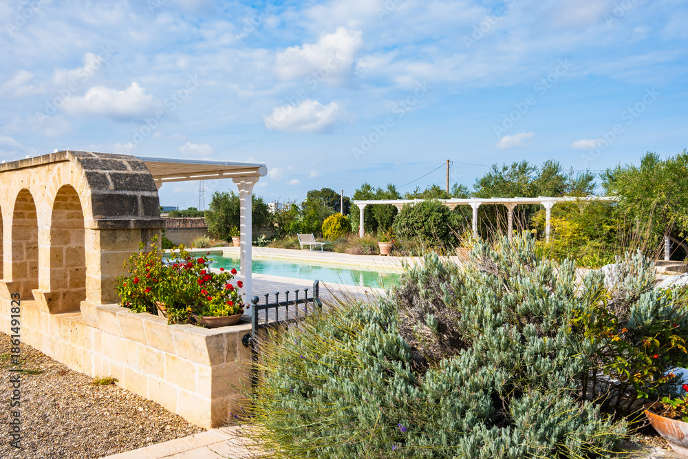 custom made wallpaper toronto digitalPeaceful countryside pool surrounded by arches, flowers, and Mediterranean plants, Apulia, Italy