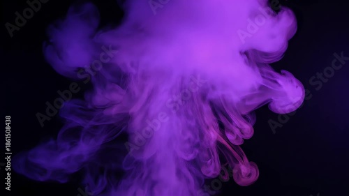 Vibrant purple smoke billows and swirls against a dark background, creating an abstract and ethereal visual effect.