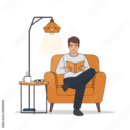 Man Reading Book in Cozy Armchair Under Floor Lamp