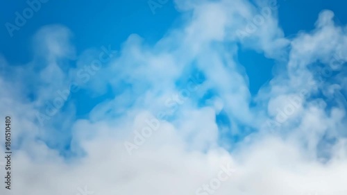 Three fluffy white clouds set against a bright blue sky backdrop