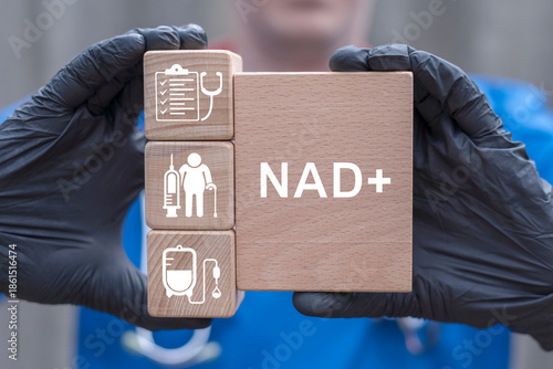 NAD+ intravenous or syringe injection of vitamins, supplements, minerals medical therapy concept. Doctor holding wooden blocks with icons sees the text NAD+.