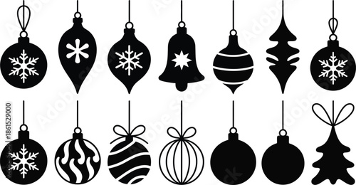 Black Christmas ornaments hanging on strings
