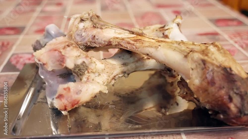 Boiled animal bones on tray for dog feeding preparation