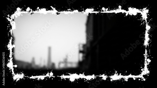 Black and white cityscape with a blurred industrial landscape at dusk or dawn