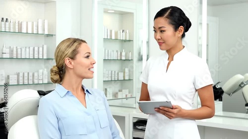Woman consults with professional in a clean bright room