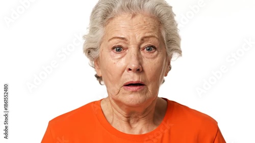 Elderly woman with surprised expression against white