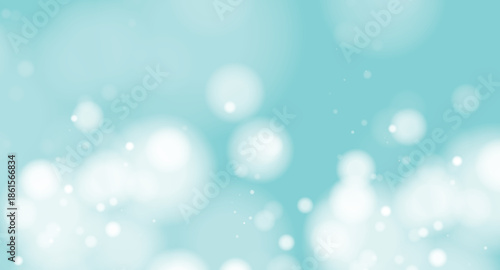 Serene light blue background with soft white bokeh circles and sparkling particles creating a dreamy ambiance