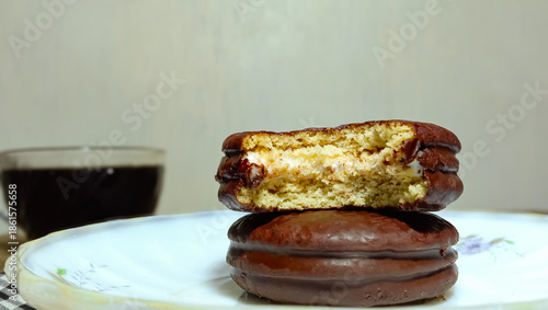 Close-up view of a chocolate snack with visible interior textures and soft marshmallow filling.