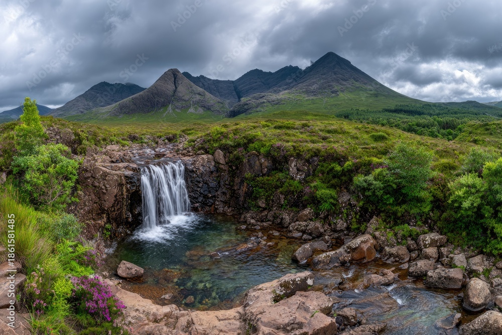 Obraz premium Scenic waterfall cascading into a pool against mountain range landscape