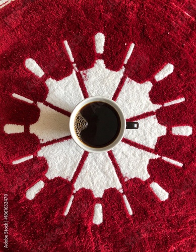 Coffee Cup Centered on Red Textile Pattern Flat Lay