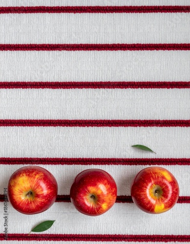 Red Apples on White Striped Textile flat lay with Copy Space
