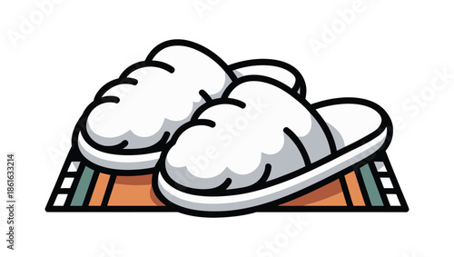 Cozy white slippers rest on a striped rug for comfort and relaxation.