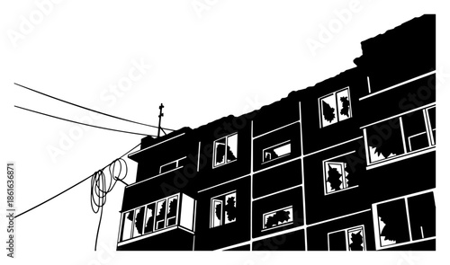 Silhouette of destroyed apartment building with broken windows and wires