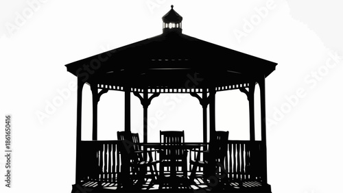 Silhouette of a wooden gazebo with chairs and table.