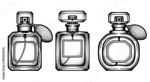 Three Vintage Perfume Bottles with Atomizers in a Row.
