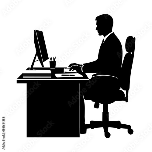 Silhouette of a person working at a desk using a computer in an office setting.