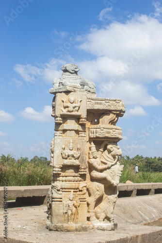 India, Karnataka, Mysuru, Beautifully Carved Pillar of Hindu Temple in Bank of Kaveri River. Carvings of Hindu Deities.