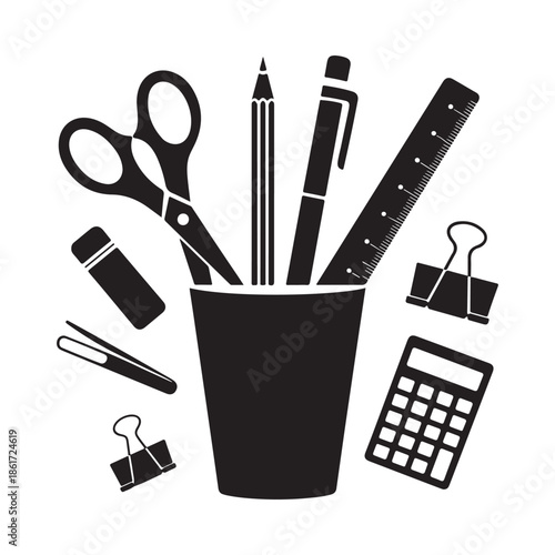 Stationery collection including scissors pens pencils ruler and other office supplies in a cup