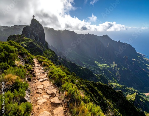 Rocky hiking trail crests sharp mountain ridge, with scenic, sunny vista