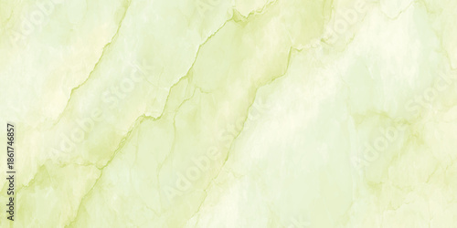 A striking close up view of a pale green onyx marble surface with natural veining patterns and textures