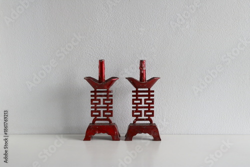 Vintage Chinese candlesticks, which are associated with weddings, carved with the Shuangxi symbol (囍), known as the 