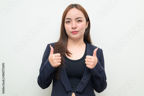 Wallpaper Mural Portrait of Asian businesswoman against white background giving thumbs up approval with both hands Torontodigital.ca