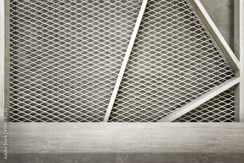Concrete Table with White Expanded Metal Mesh and Concrete Background.