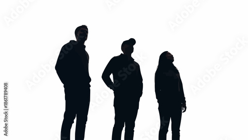Three Silhouettes of People Standing Together Looking Upwards.