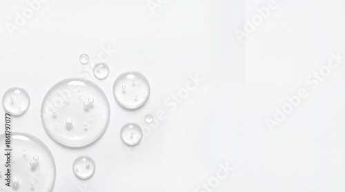 Clear Cosmetic Gel Drops and Bubbles on White Background