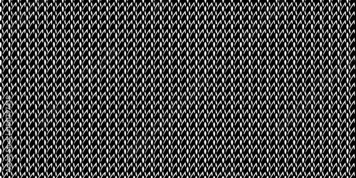 A close up view of a tightly woven black and white checkered pattern