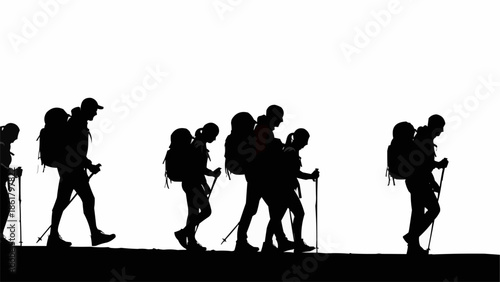 Silhouettes of hikers walking on a path with backpacks and poles.