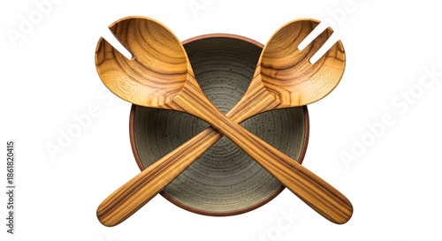 Wooden Utensils Crossed on a Dark Plate on a White Background