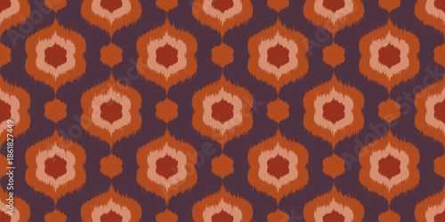 Ikat seamless pattern with floral motif. Abstract ethnic vector print with rug texture. Vintage decorative ornament retro background. Batik art traditional wallpaper.