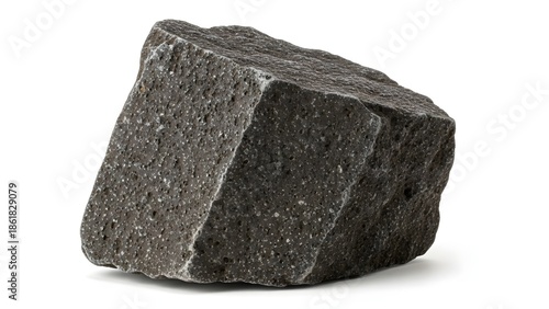 A large, dark grey granite rock fragment is displayed on a white background from a slightly elevated viewpoint