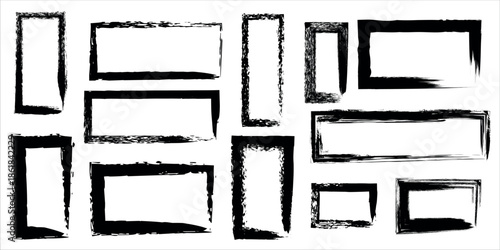 A collection of nine empty picture frames in various sizes with black borders