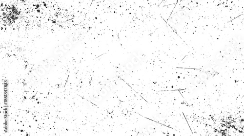Black ink splatters and scratches on white background abstract texture