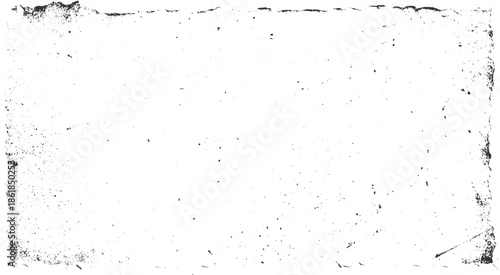 Black speckle grunge texture on white background with rough edges
