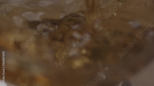 Alcohol being poured in a glass